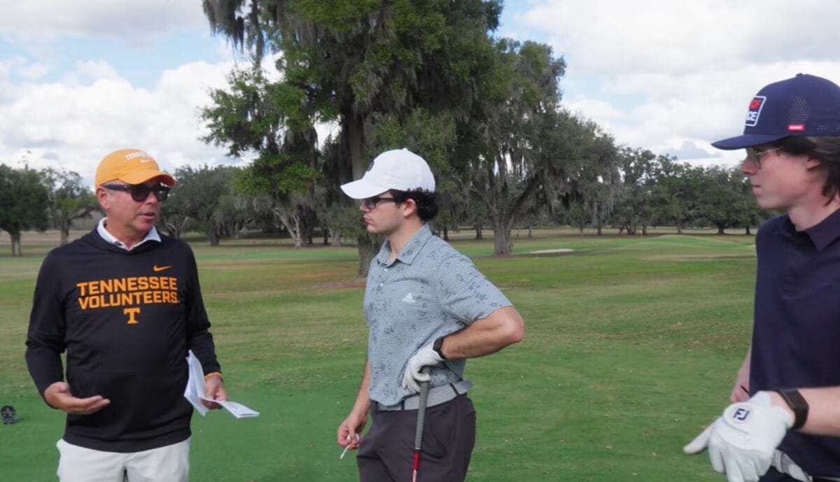 Tennessee Volunteers coach engaging with junior golfers at CGX camp
